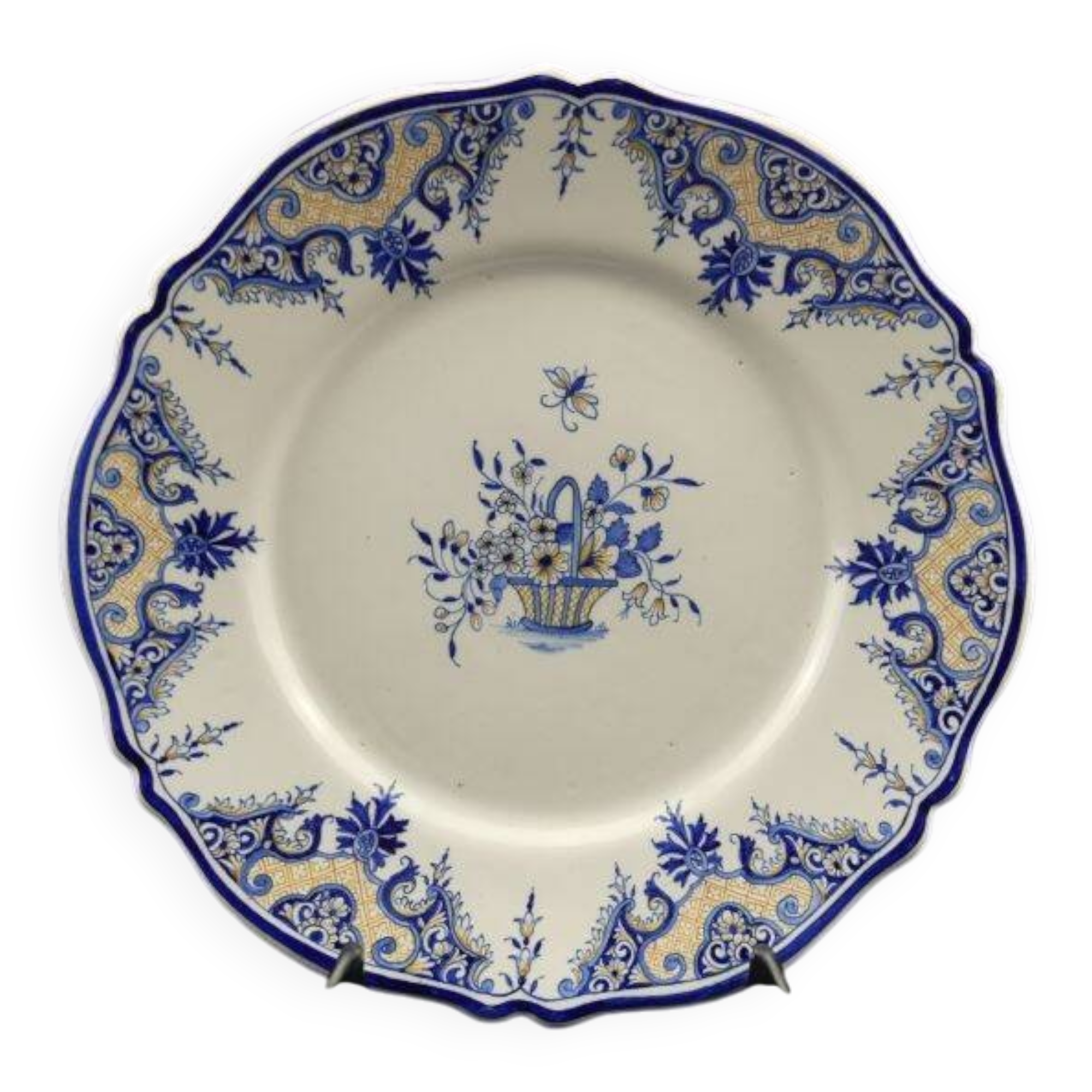 Old earthenware dish with a floral basket decoration.