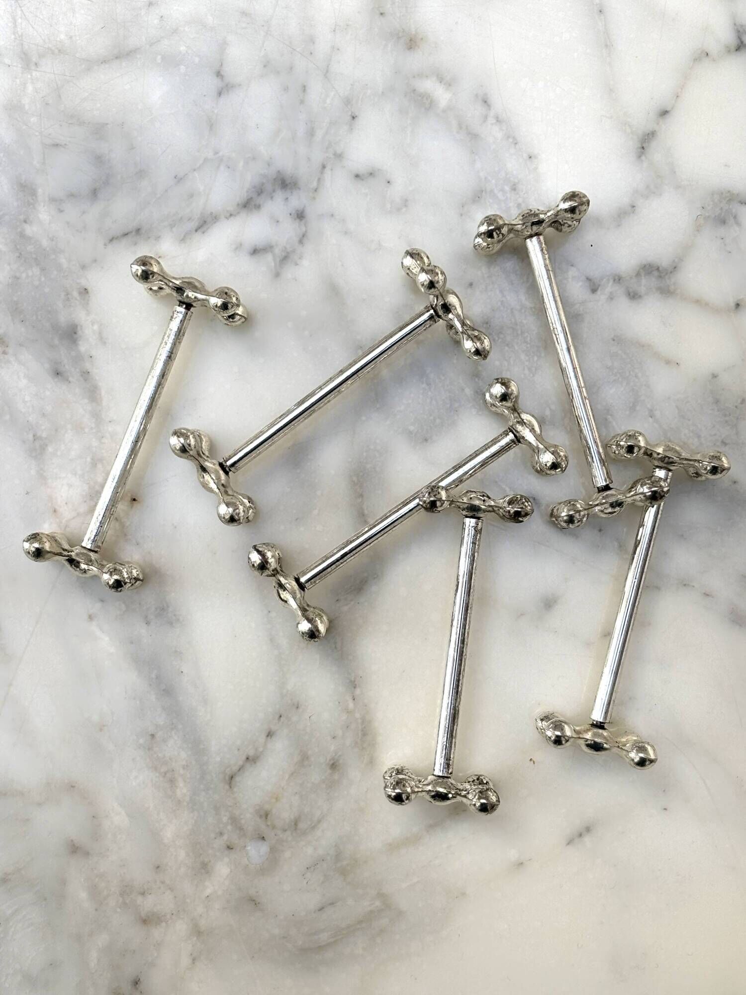 Set of 6 silver metal knife rests in the Letang Remy style