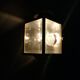 Brass and beveled glass lantern-like wall lamps in brass and beveled glass