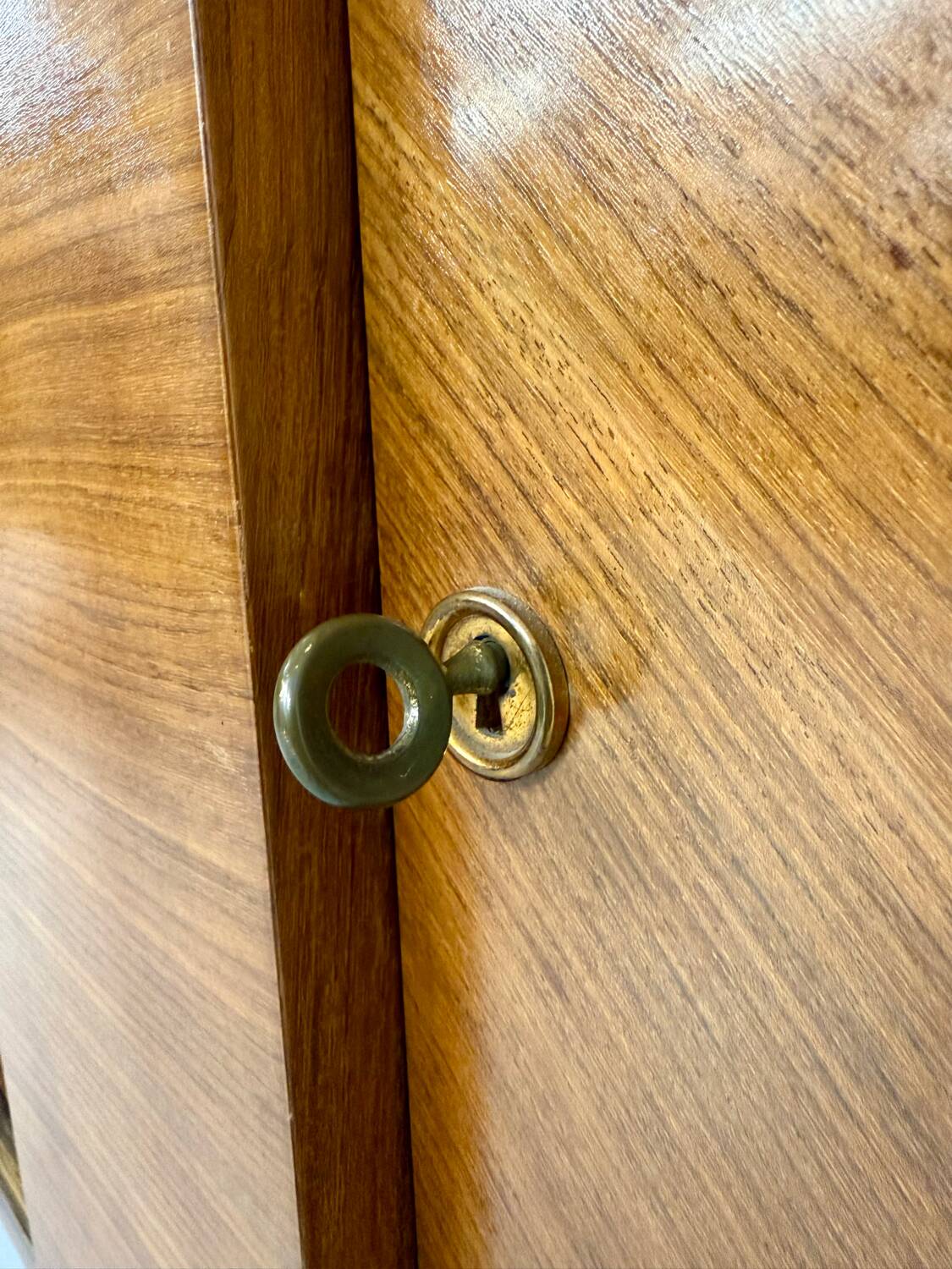Antique art deco sideboard from the 1930s with veneered wood and bronze insert