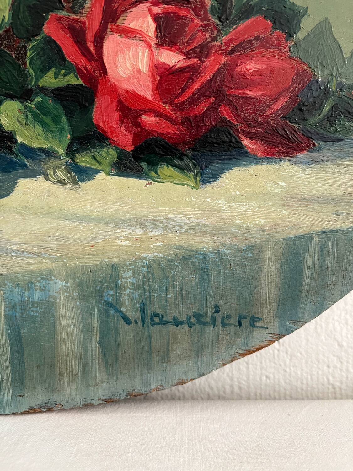 Old oil painting on oval wood with roses thrown from the 30s