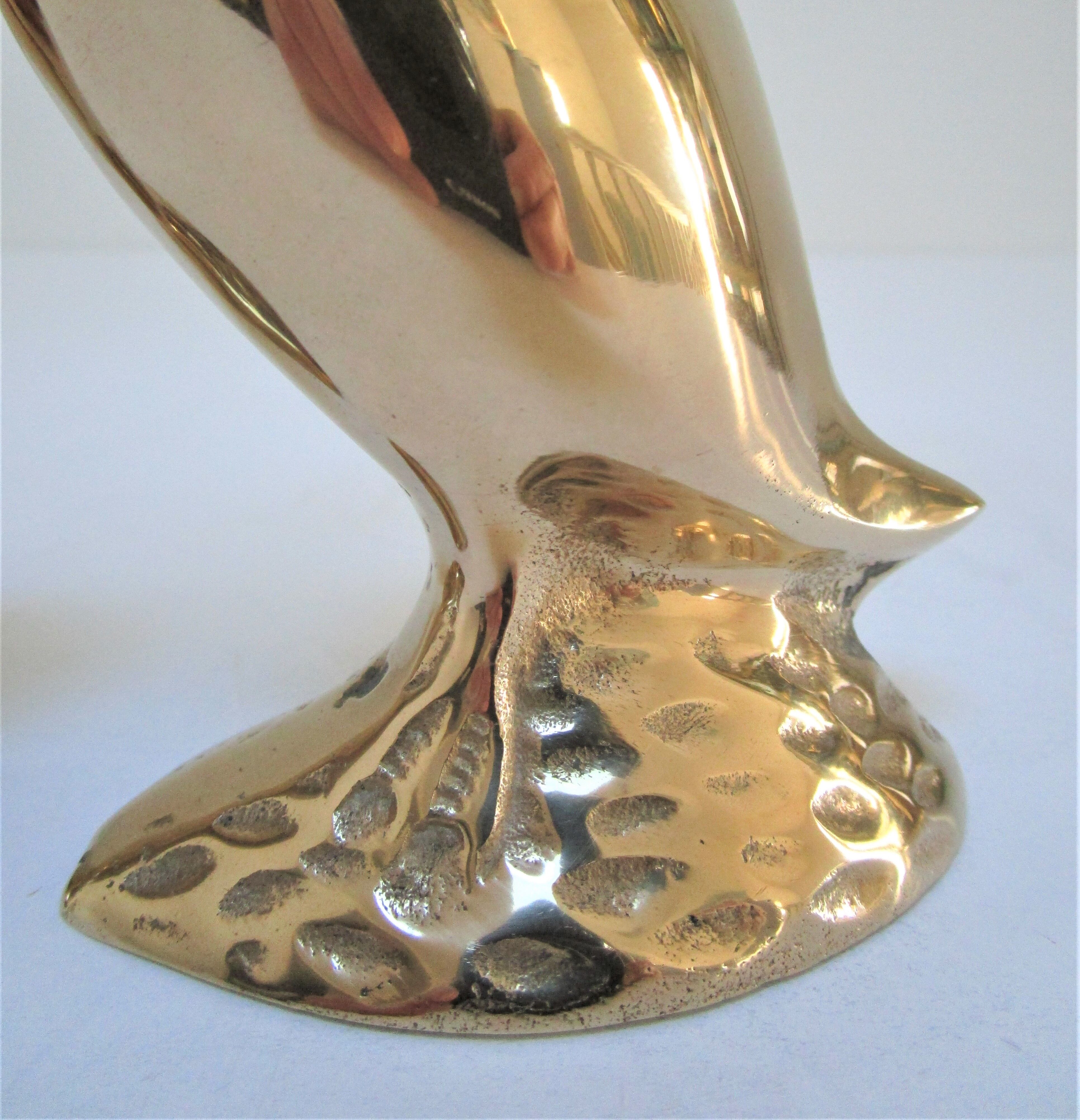 Pair of stylized birds in solid brass