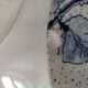 Two flat plates in earthenware with blue floral decoration.