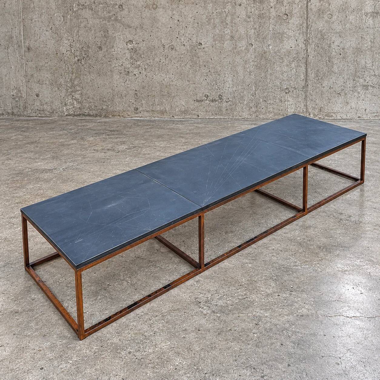 Weighty coffee table with solid iron frame and stone slate table tops, made on commission by architect Alex Vervoordt, Belgium 1990s