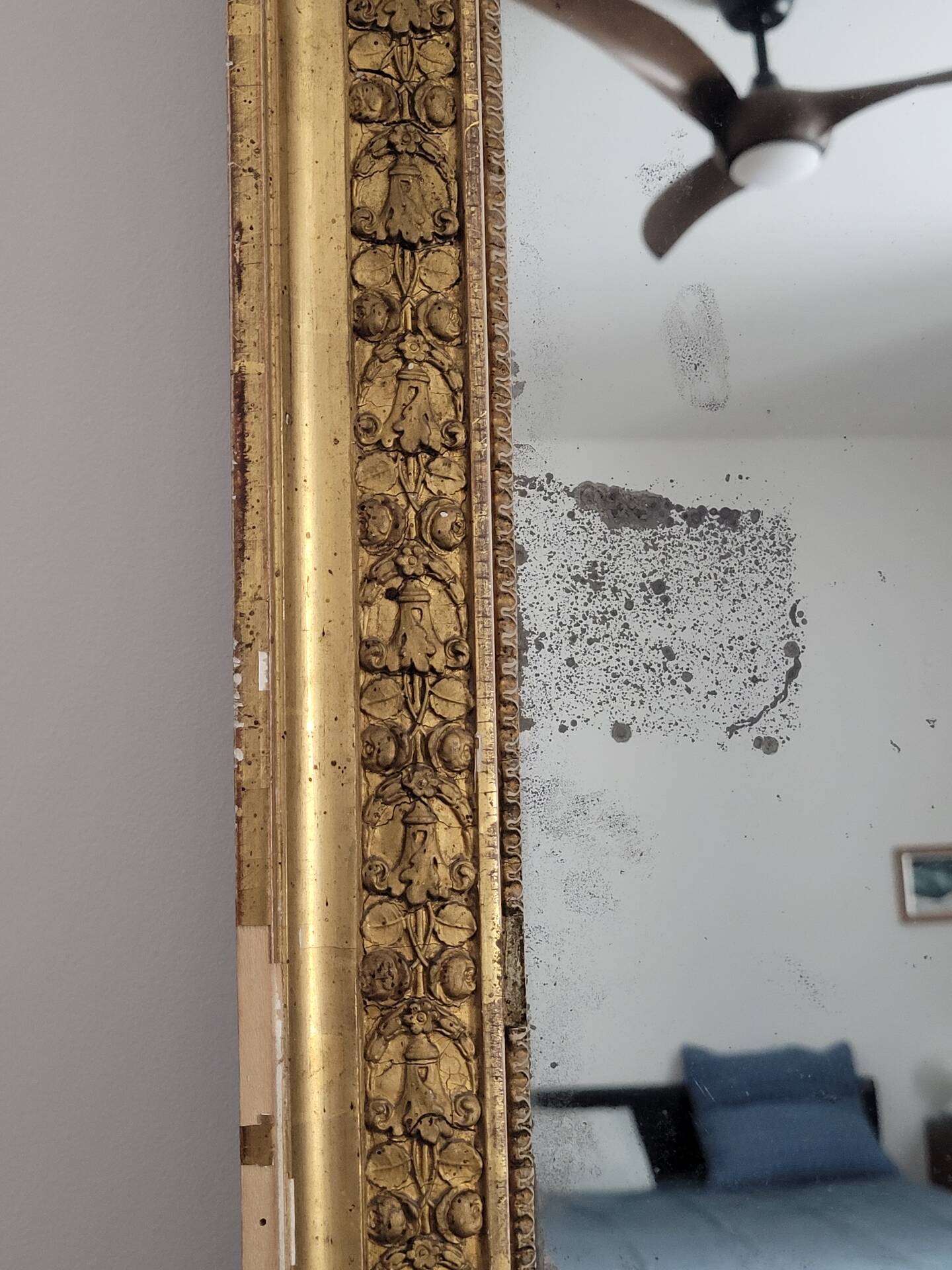 Golden stucco and wood Empire mirror
