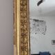 Golden stucco and wood Empire mirror