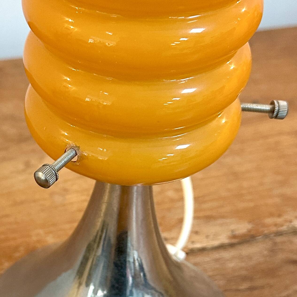 Vintage orange lamp with chrome tulip base and glass shade