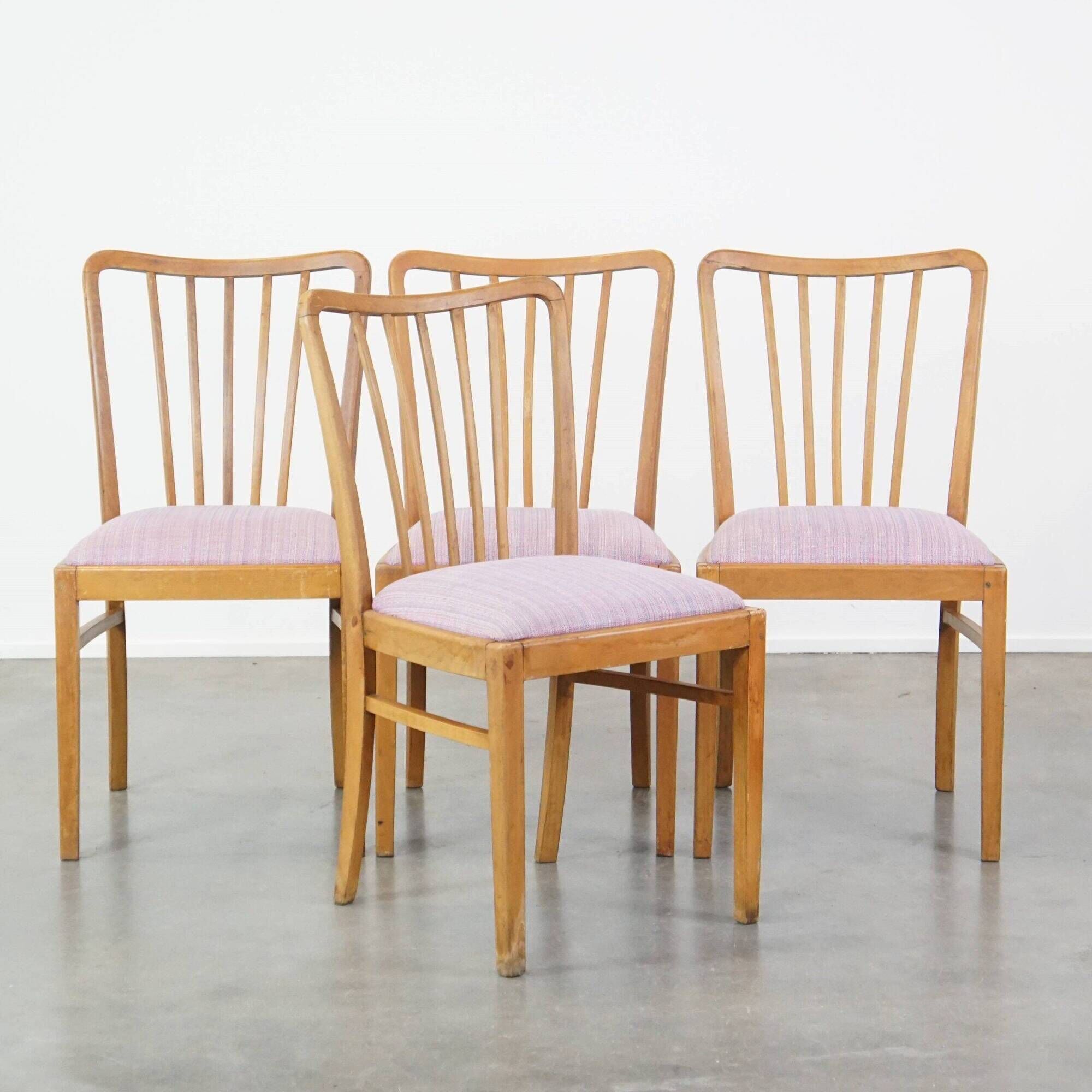 Set of four dining chairs from the 1970s with fabric seat and wooden frame