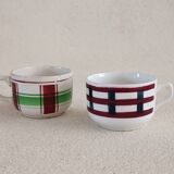 2 mismatched iron earth cups