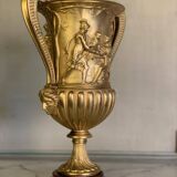Golden bronze urn, base of red griotte marble.