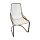 Tubular metal chair covered with gilding