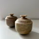 2 small stone urns