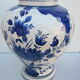Ceramic vase earthenware, blue floral decoration on a white background