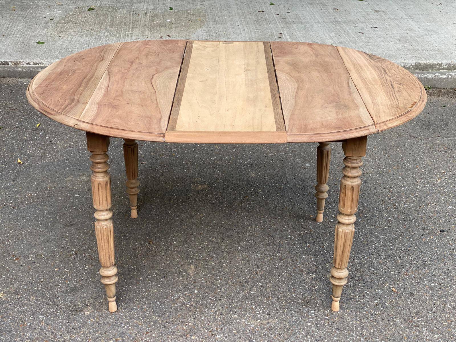 Renovated 18th century solid wood extendable round dining table with shutters