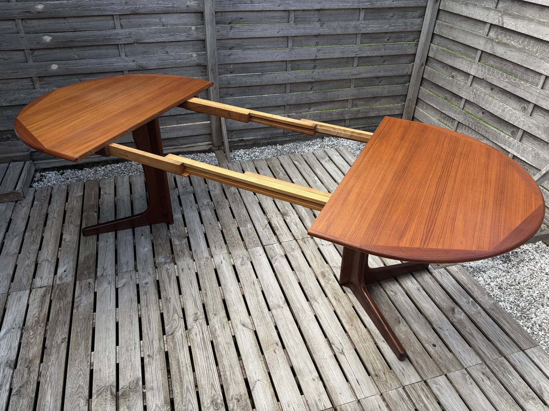 Oval teak table extendable with two leaves, Baumann style.