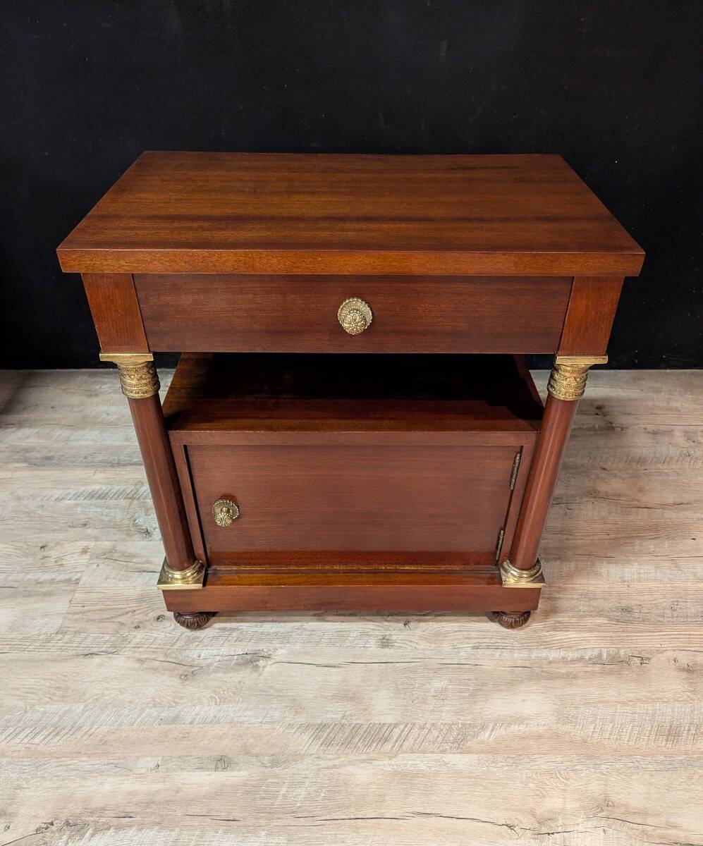 Pair of Empire style bedside tables in mahogany and gilded bronze