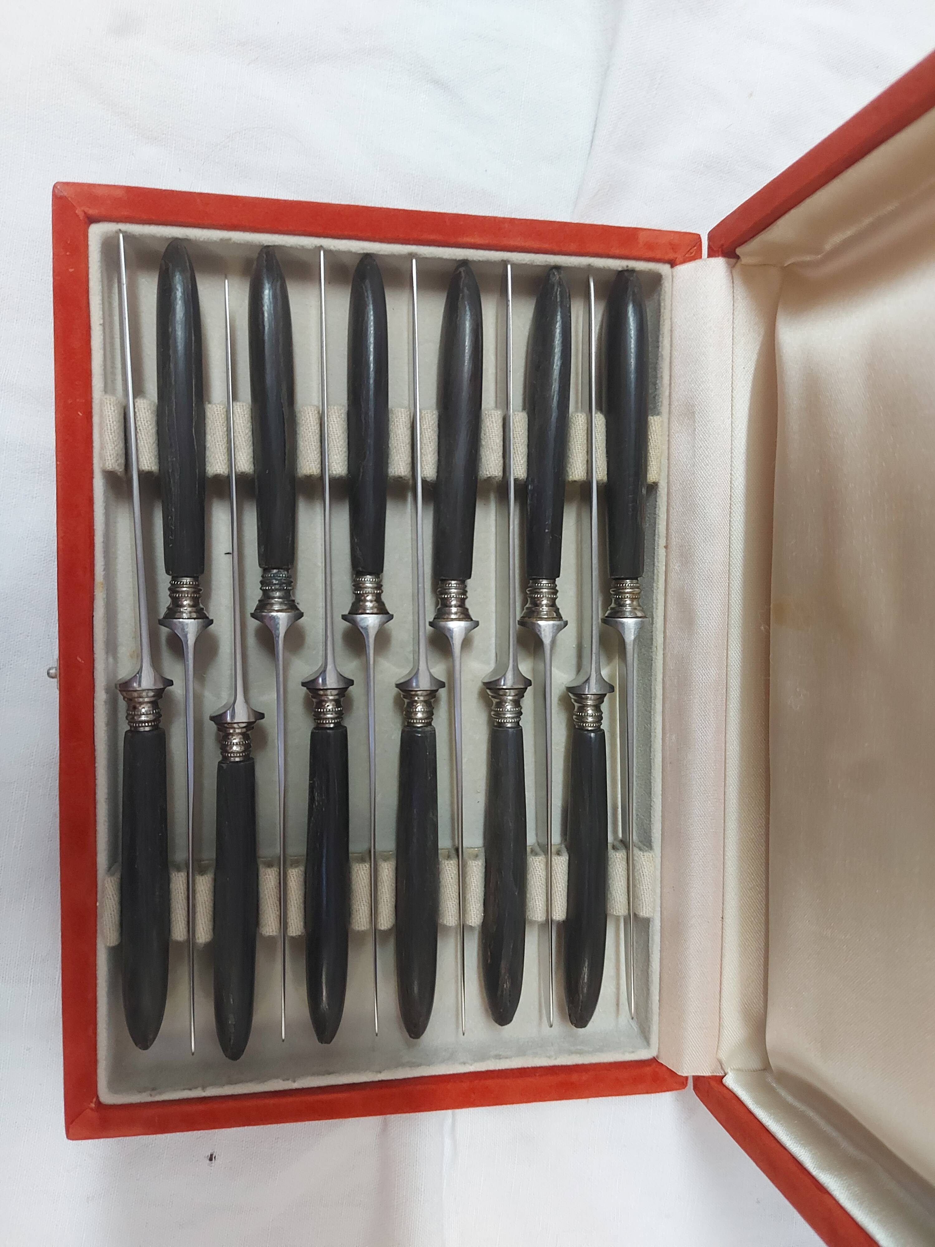12 ebony handled knives, 1950