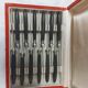 12 ebony handled knives, 1950