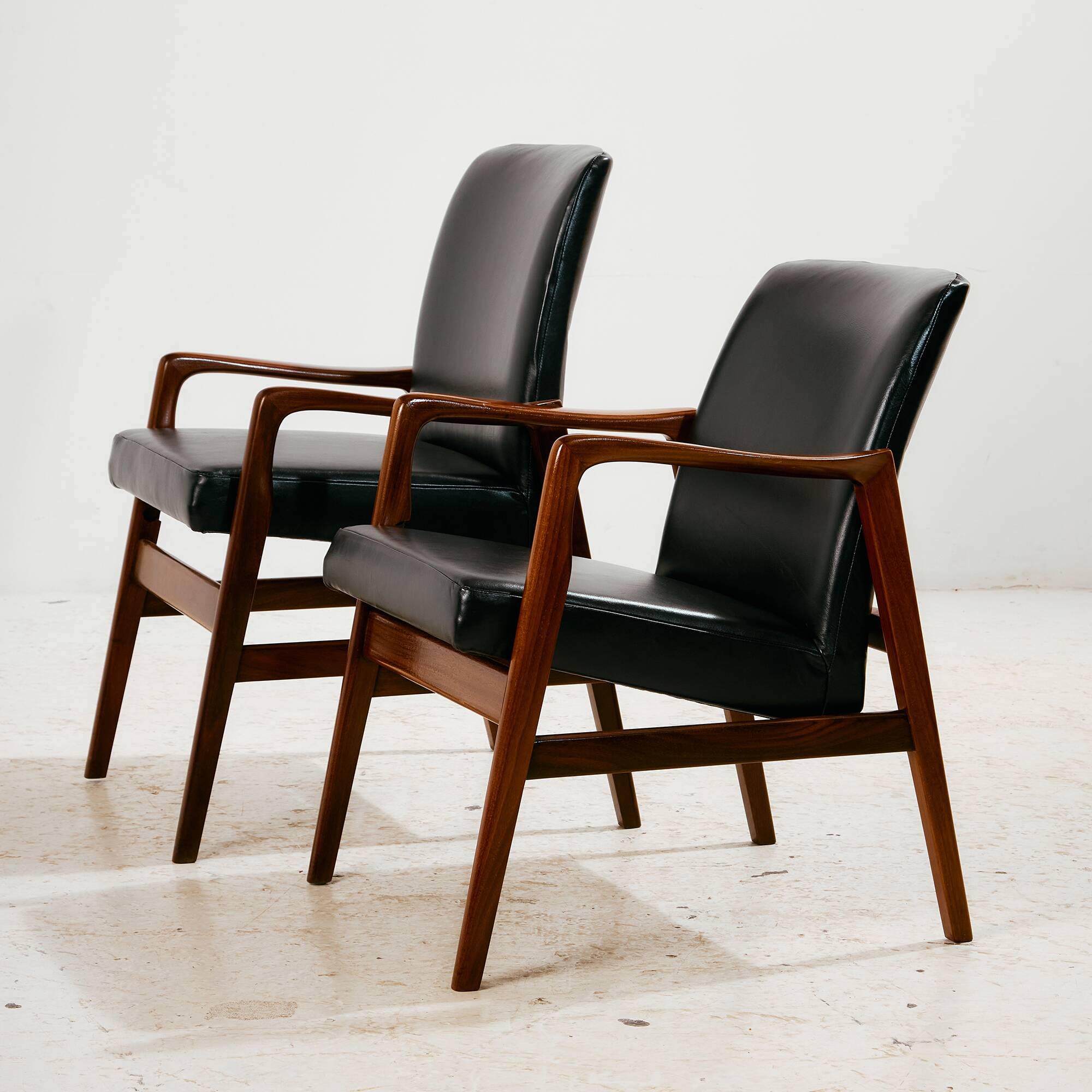 Teak armchair with leather upholstery