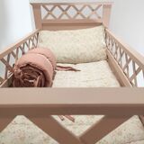 Vintage old pink wooden baby bed