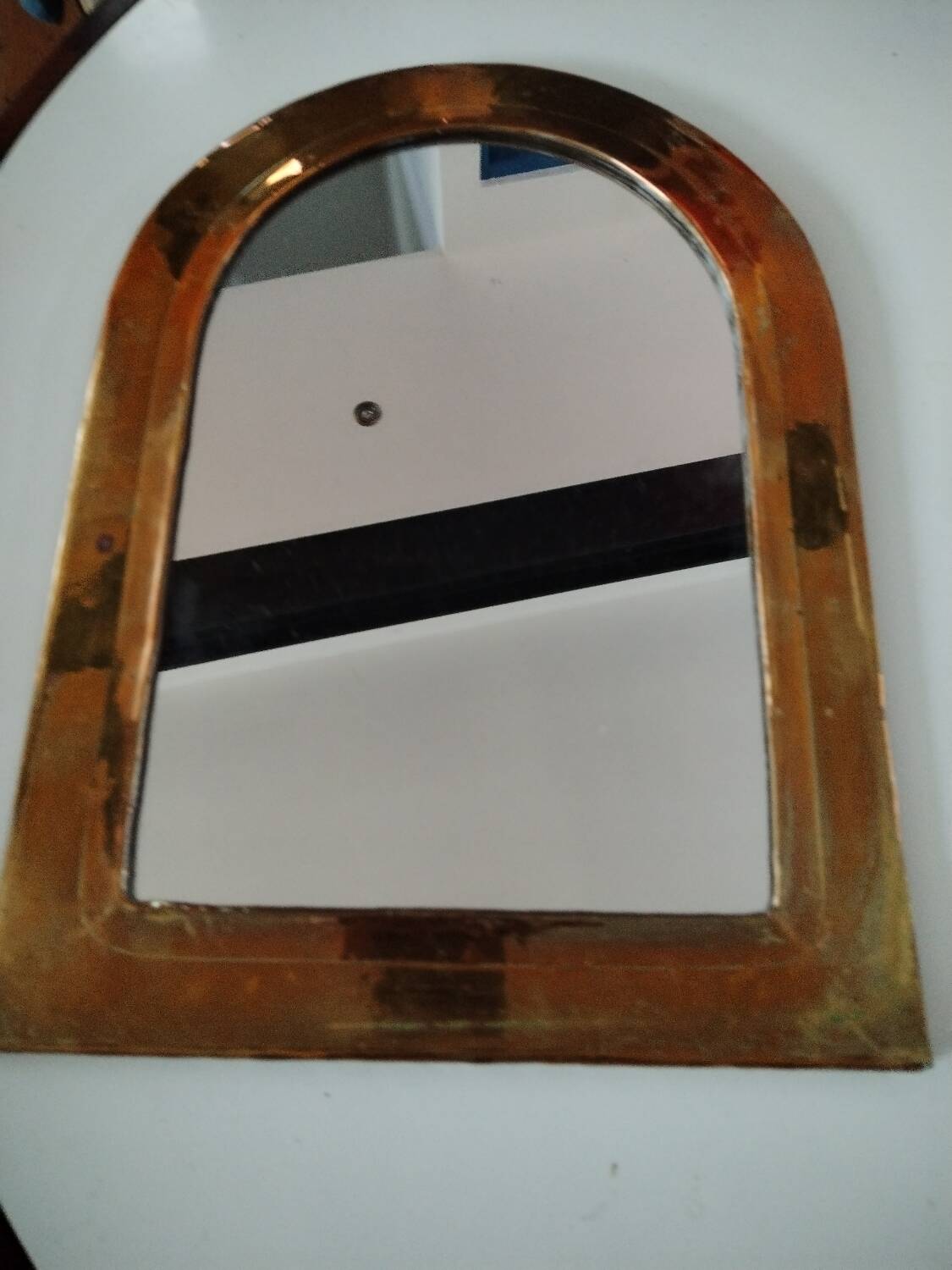 Old brass half moon mirror