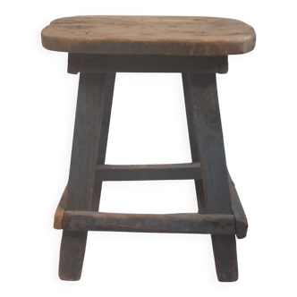Antique wooden stool in the brutalist style