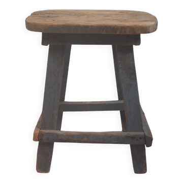 Antique wooden stool in the brutalist style