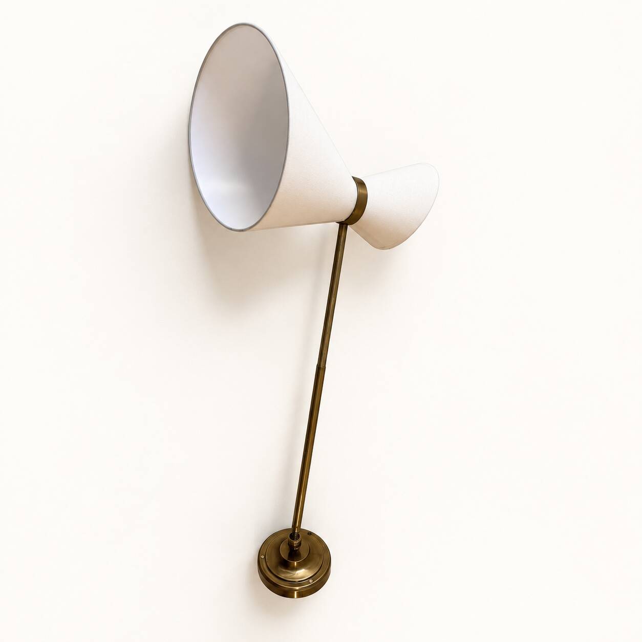 Extendable wall light in the style of Maison Lunel.
