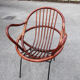 Rattan shell armchair with metal feet