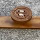 Vintage 1980 coat rack with 3 "button" hooks.