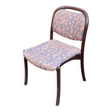 Scandinavian chair in curved solid teak wood and fabric.