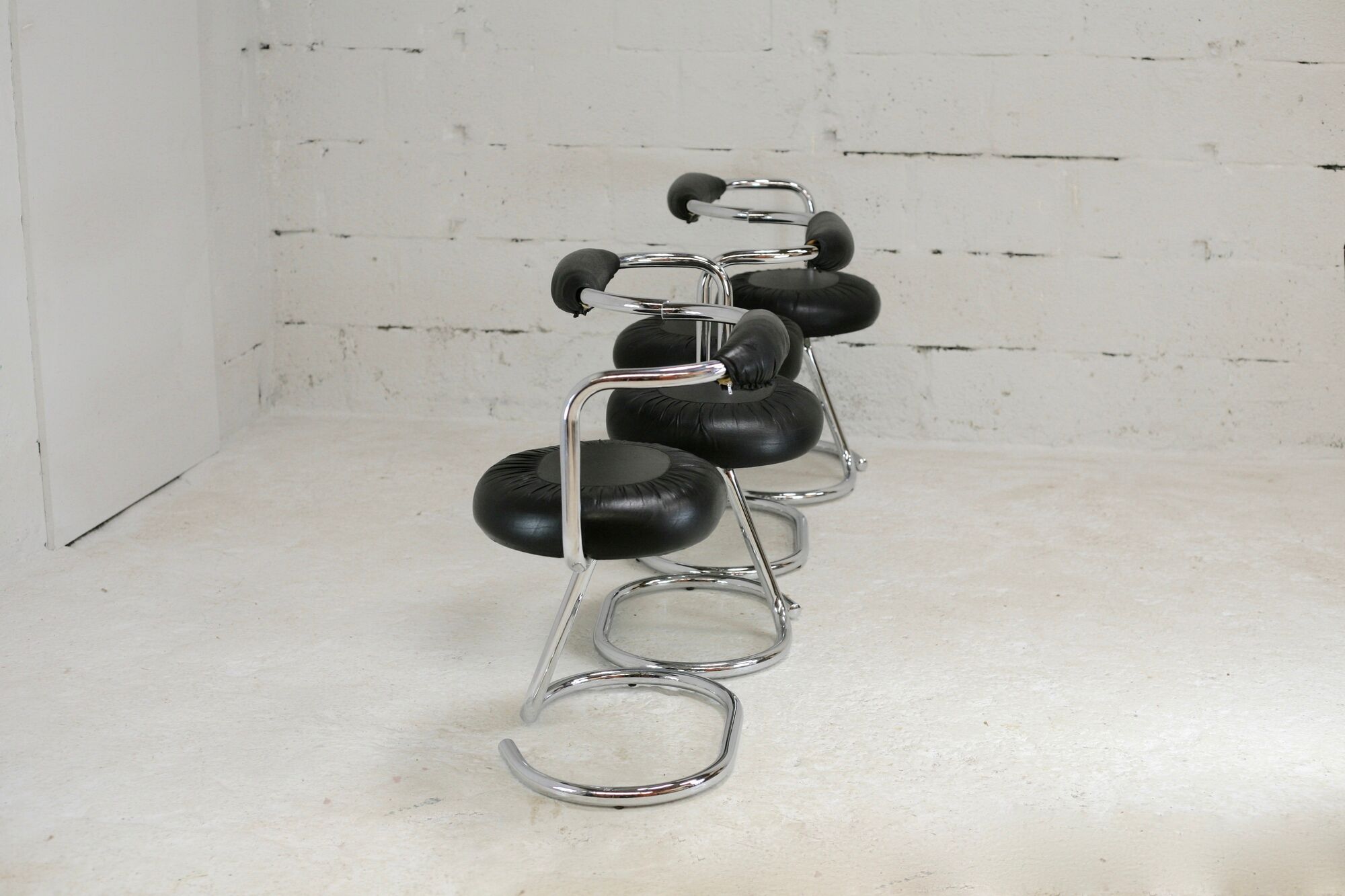 4 chairs tubular steel, imitation black leather, Italy, circa 1970