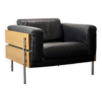 Fauteuil Robin Day pour habitat en cuir noir, bois et chrome