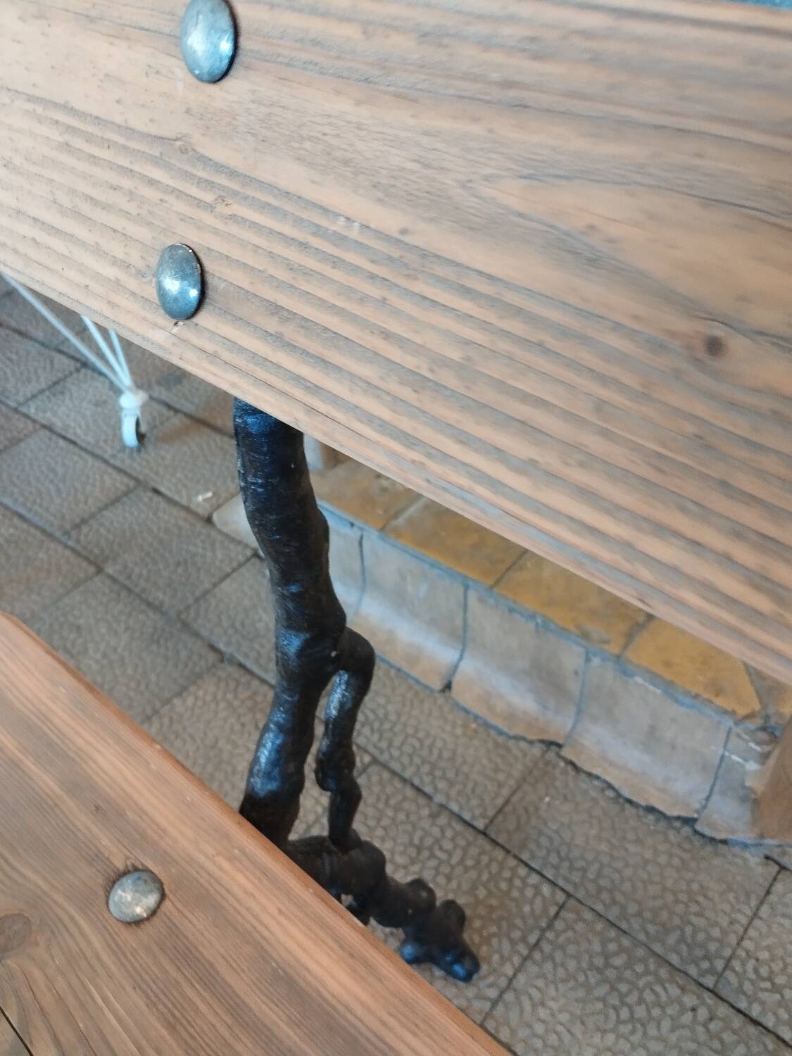 Antique garden bench with cast iron legs