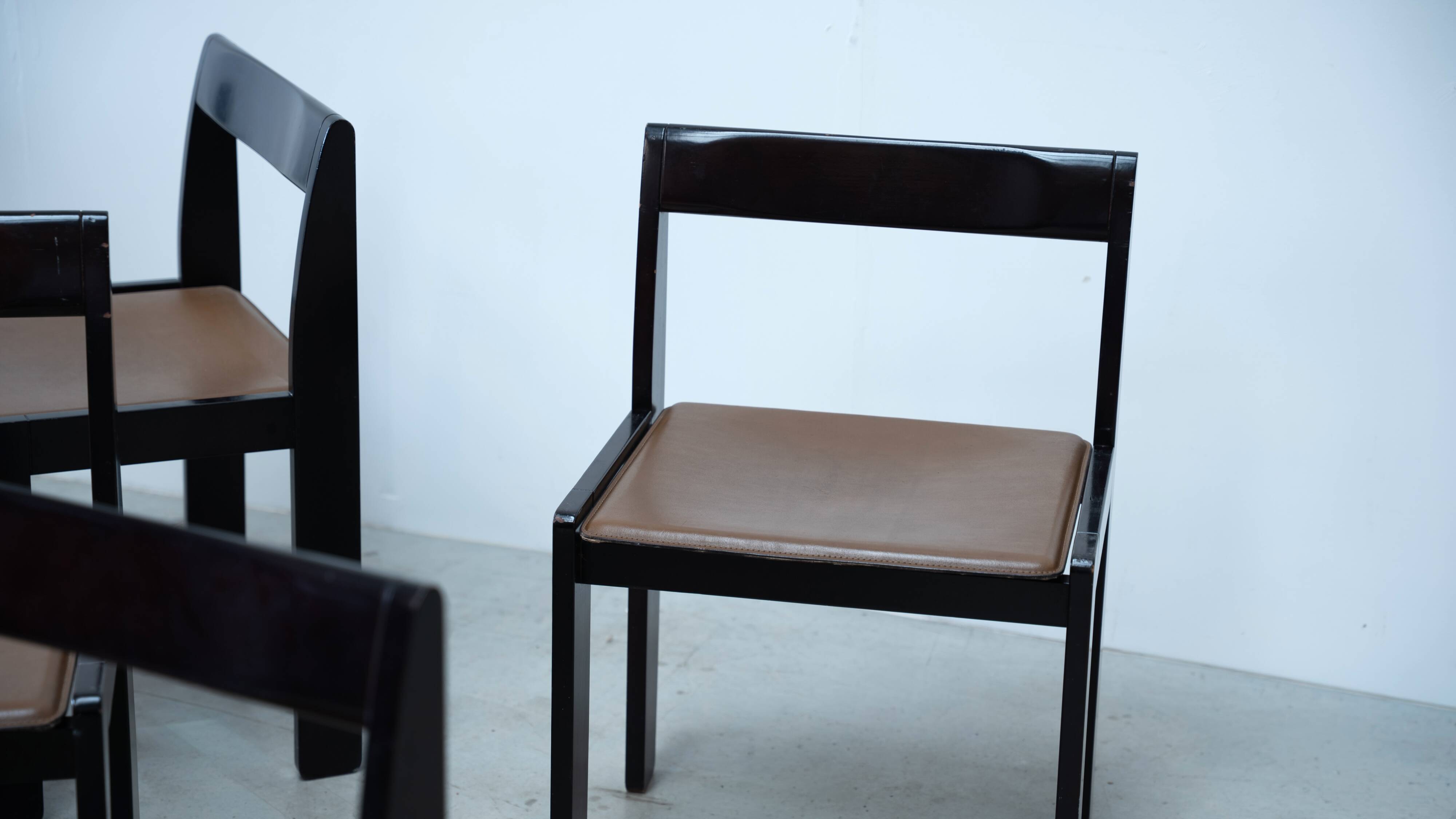 Set of eight black lacquered dining chairs