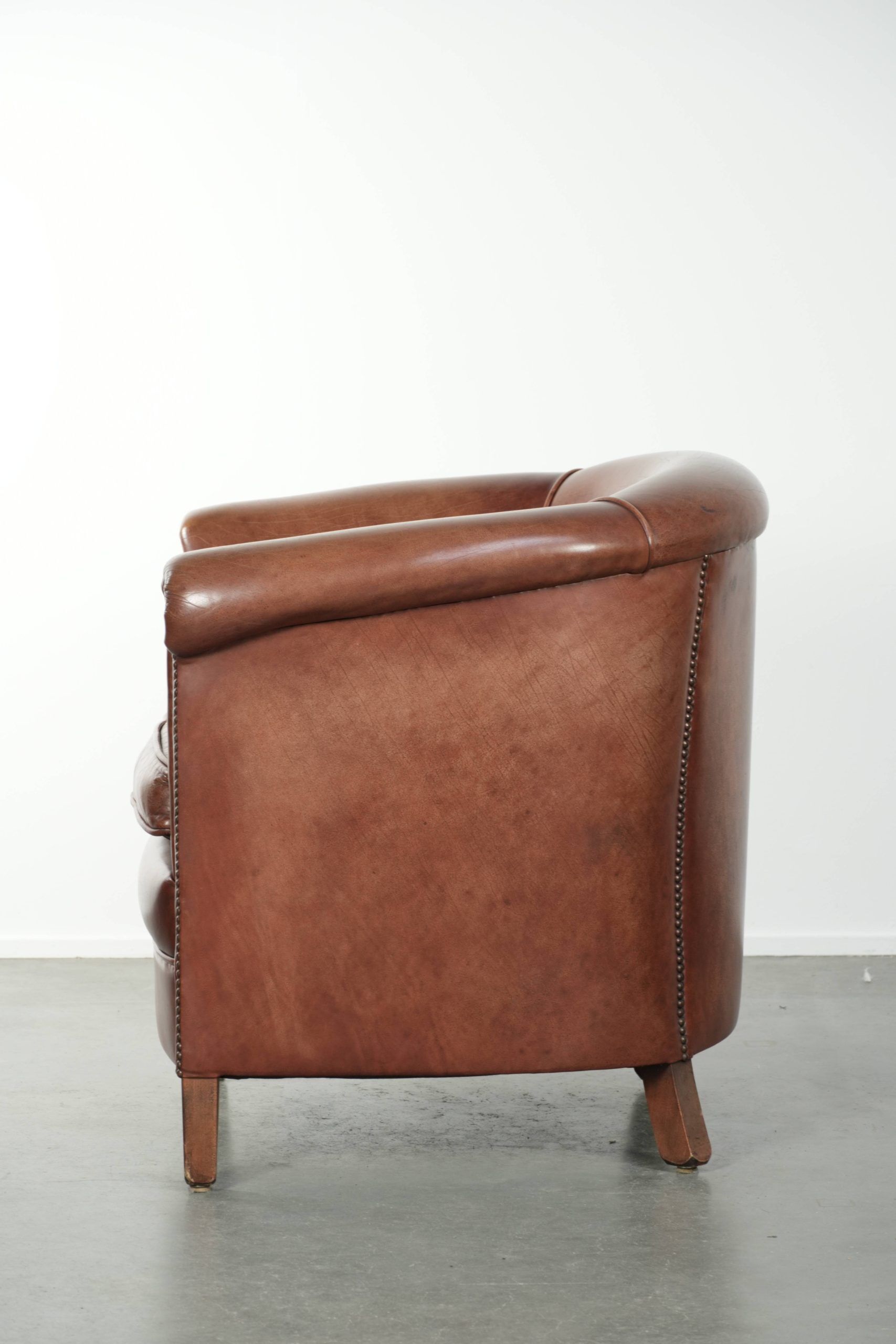 Cow leather club armchair in beautiful dark cognac colour in English style