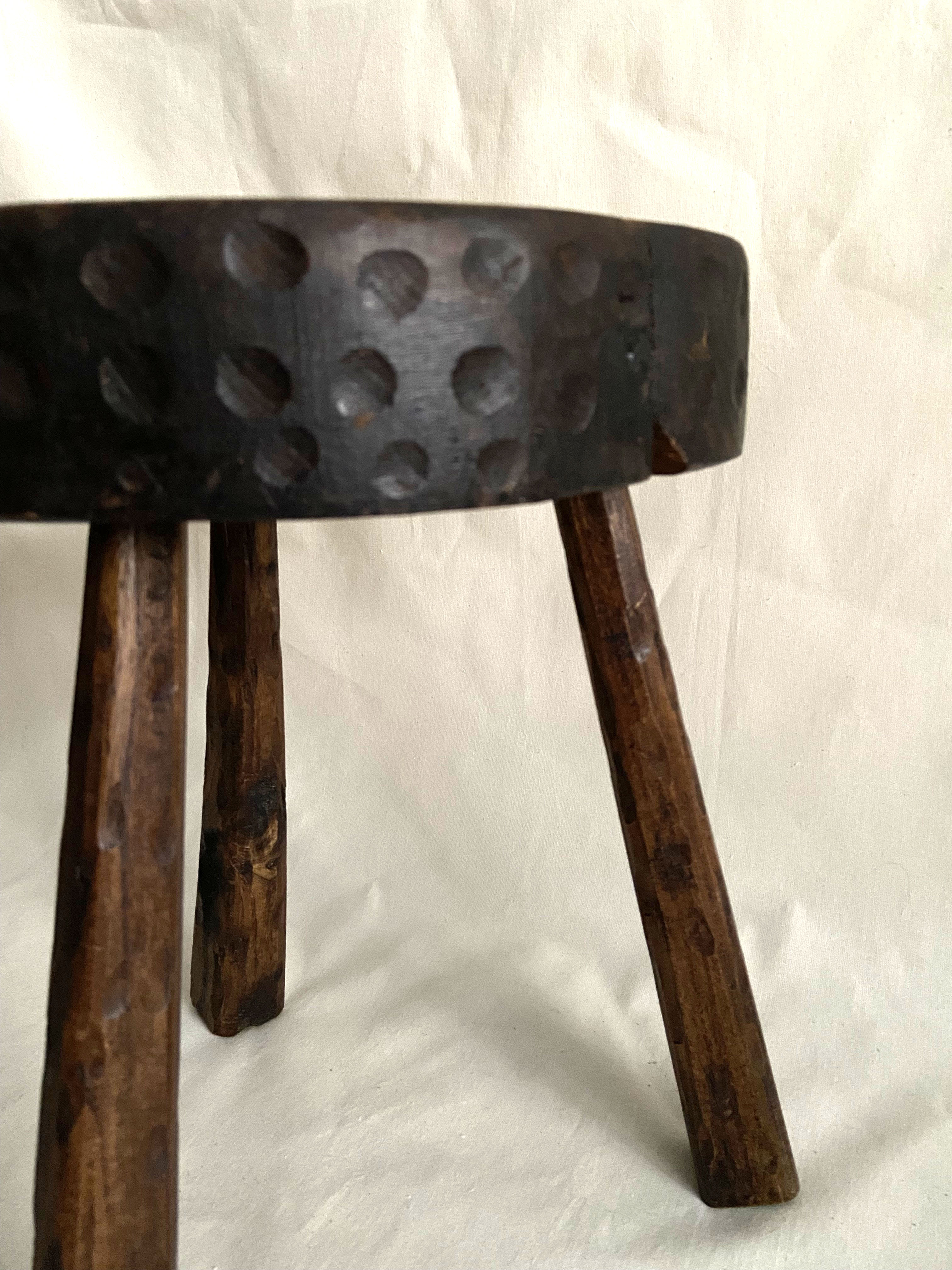 Brutalist tipode stool in carved wood