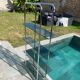 Bauhaus style bookcase with modular wall shelf, glass and chrome