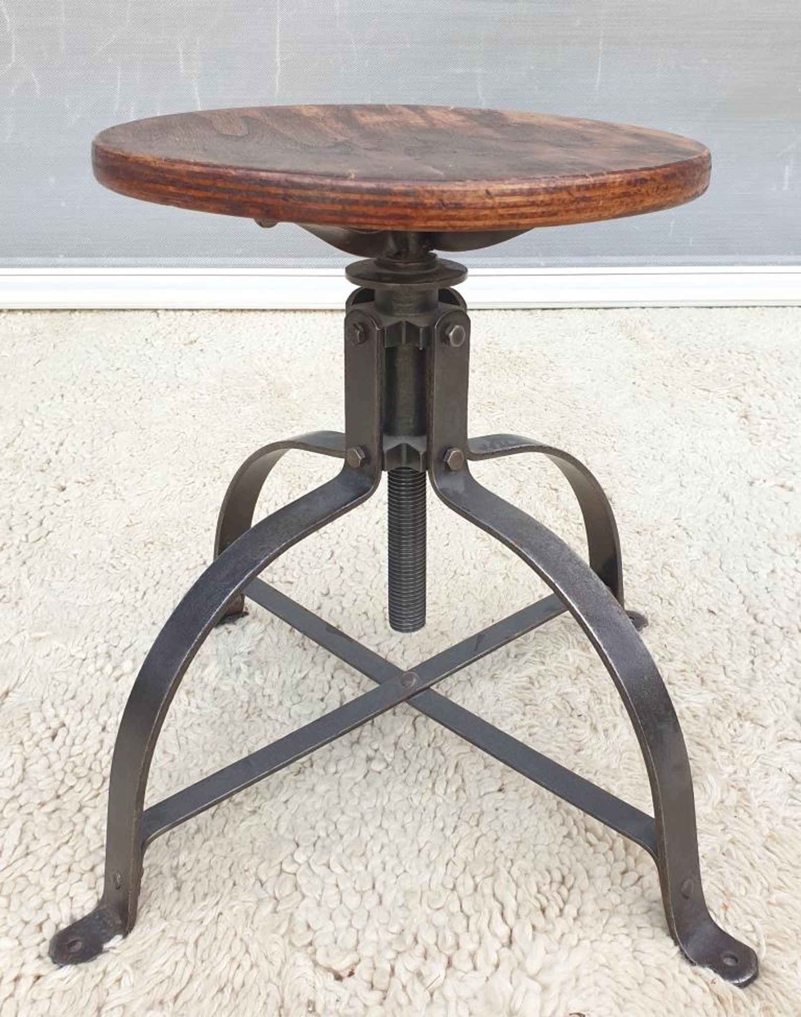 Bienaise stool of the years 1935, model 203 with 4 flat iron cathedral legs joined by a