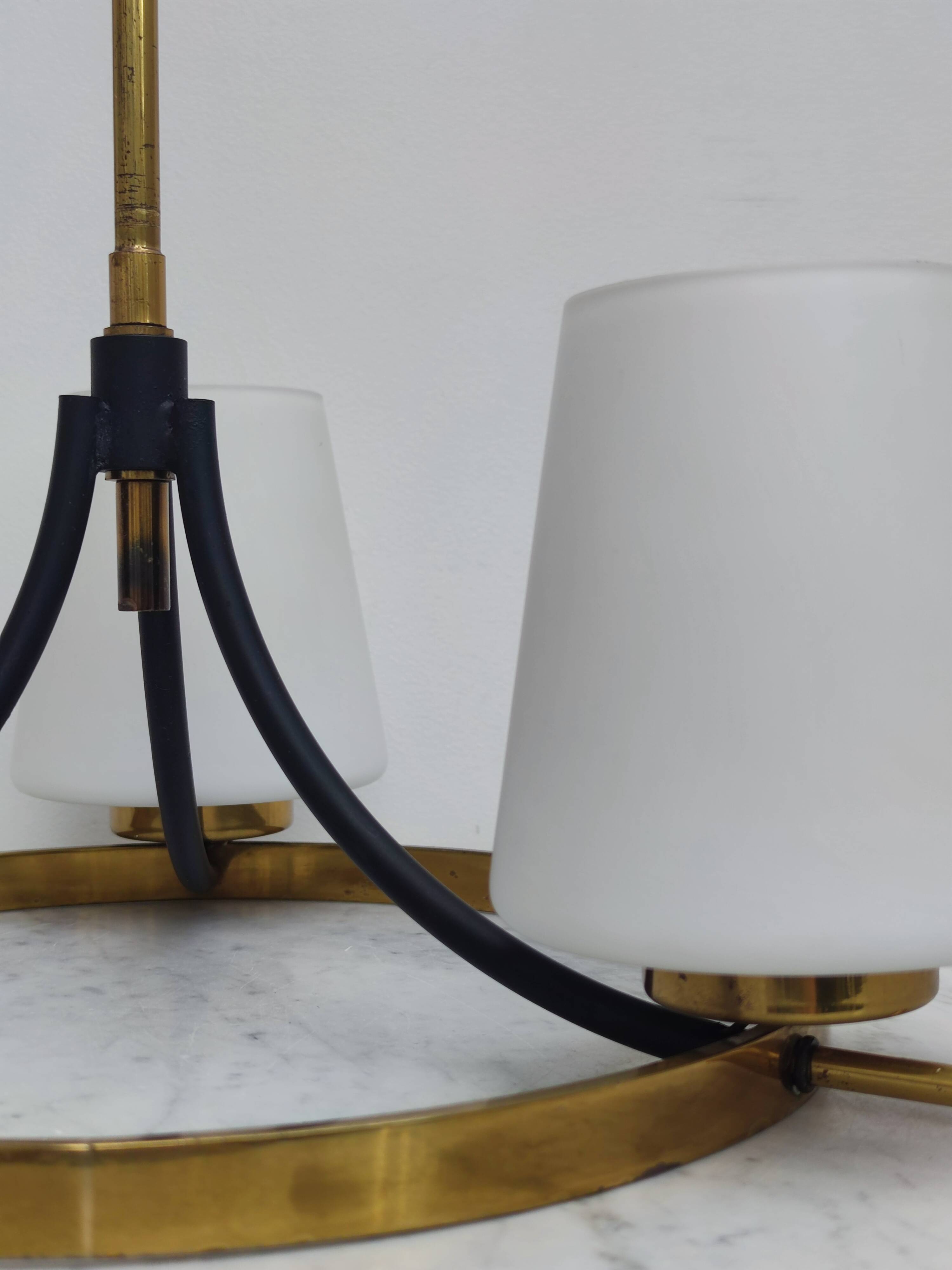 Brass chandelier and white opalines