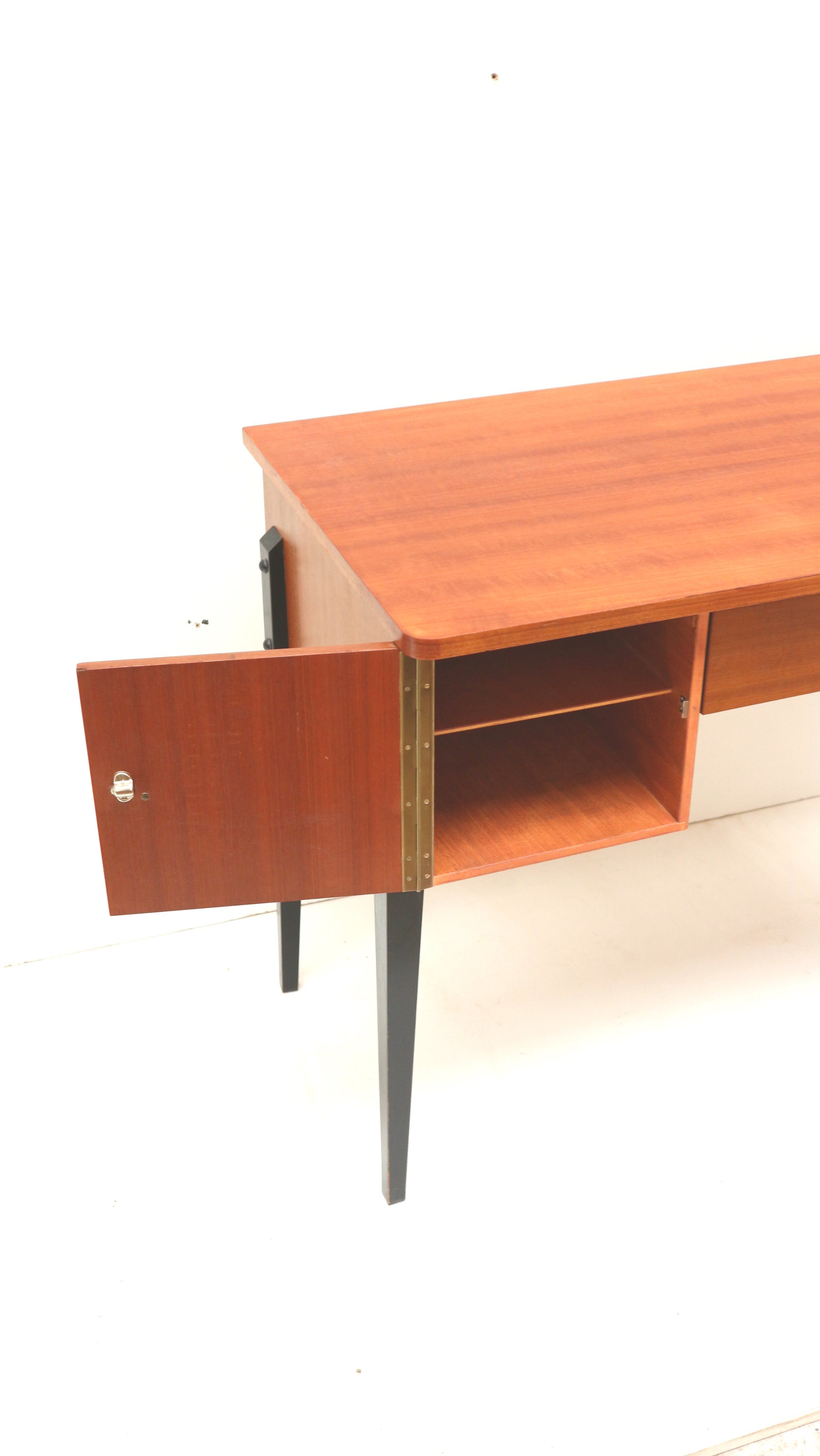 Elegant vintage desk with black legs made in the 60s