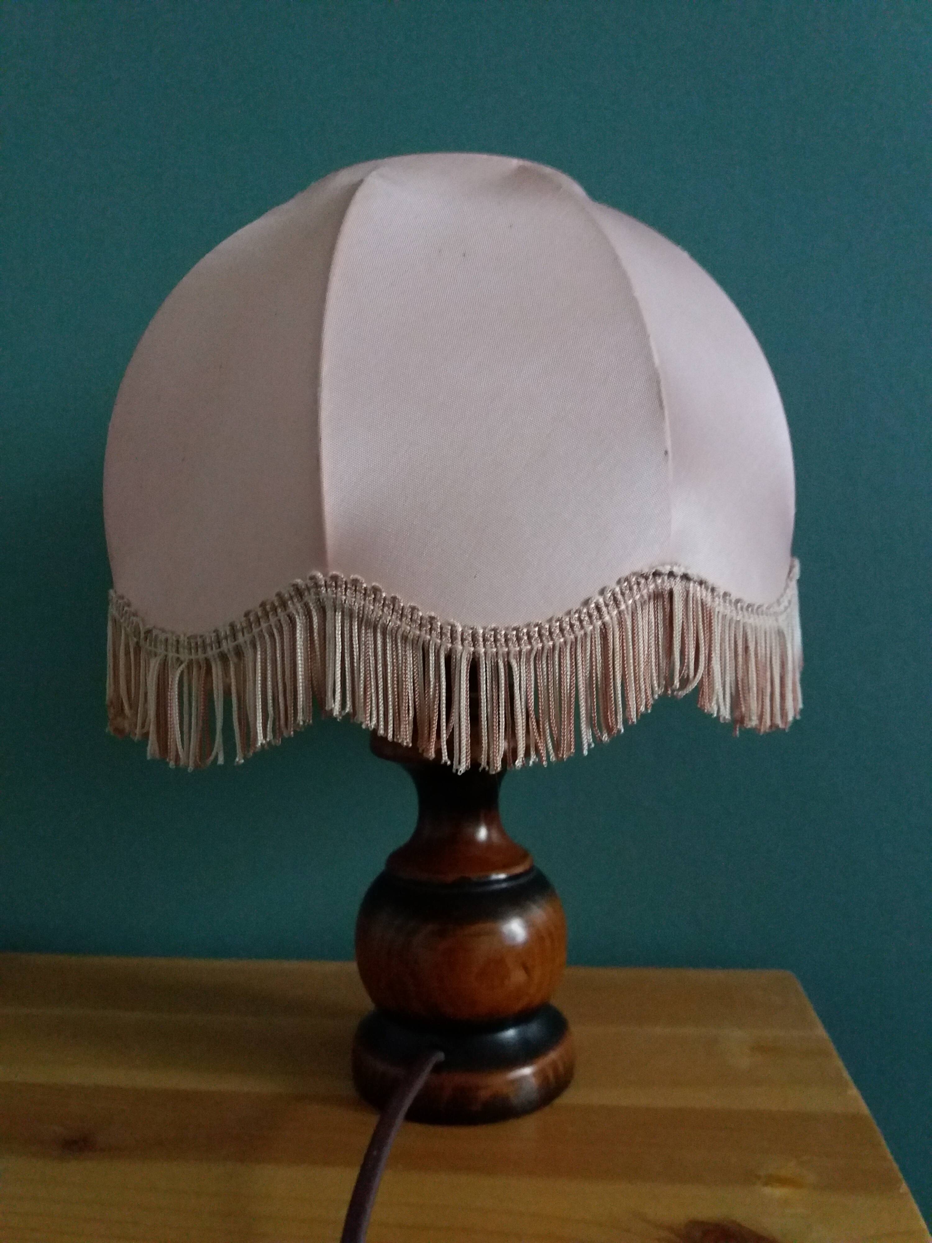 Turned wood bedside lamp with fabric lampshade