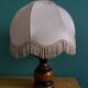 Turned wood bedside lamp with fabric lampshade