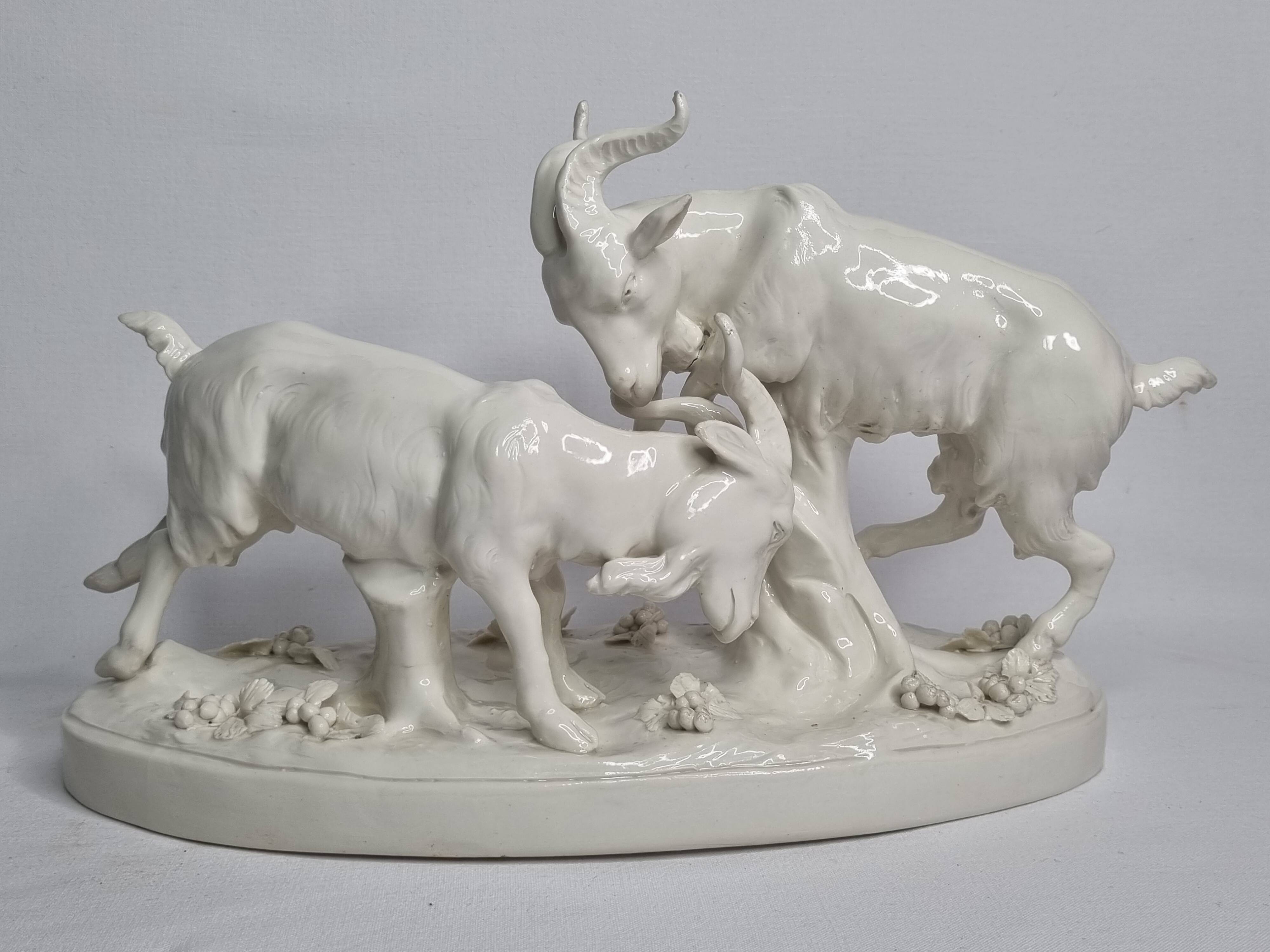Saxon porcelain group, two fighting goats, signed Röhle, 1900