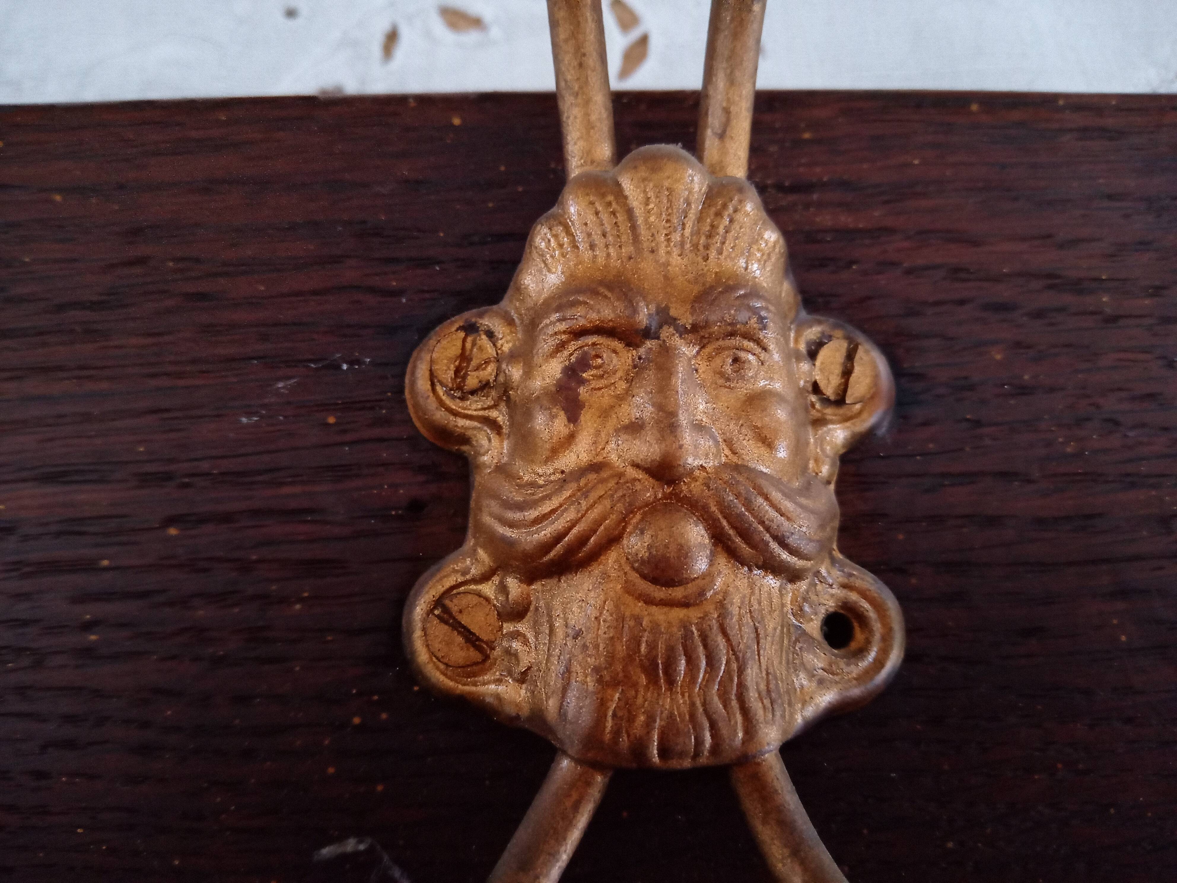 Wall coat rack 6 brass patères form mascarons