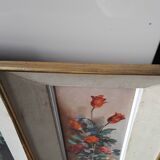 Pair of framed paintings featuring a composition of flowers.