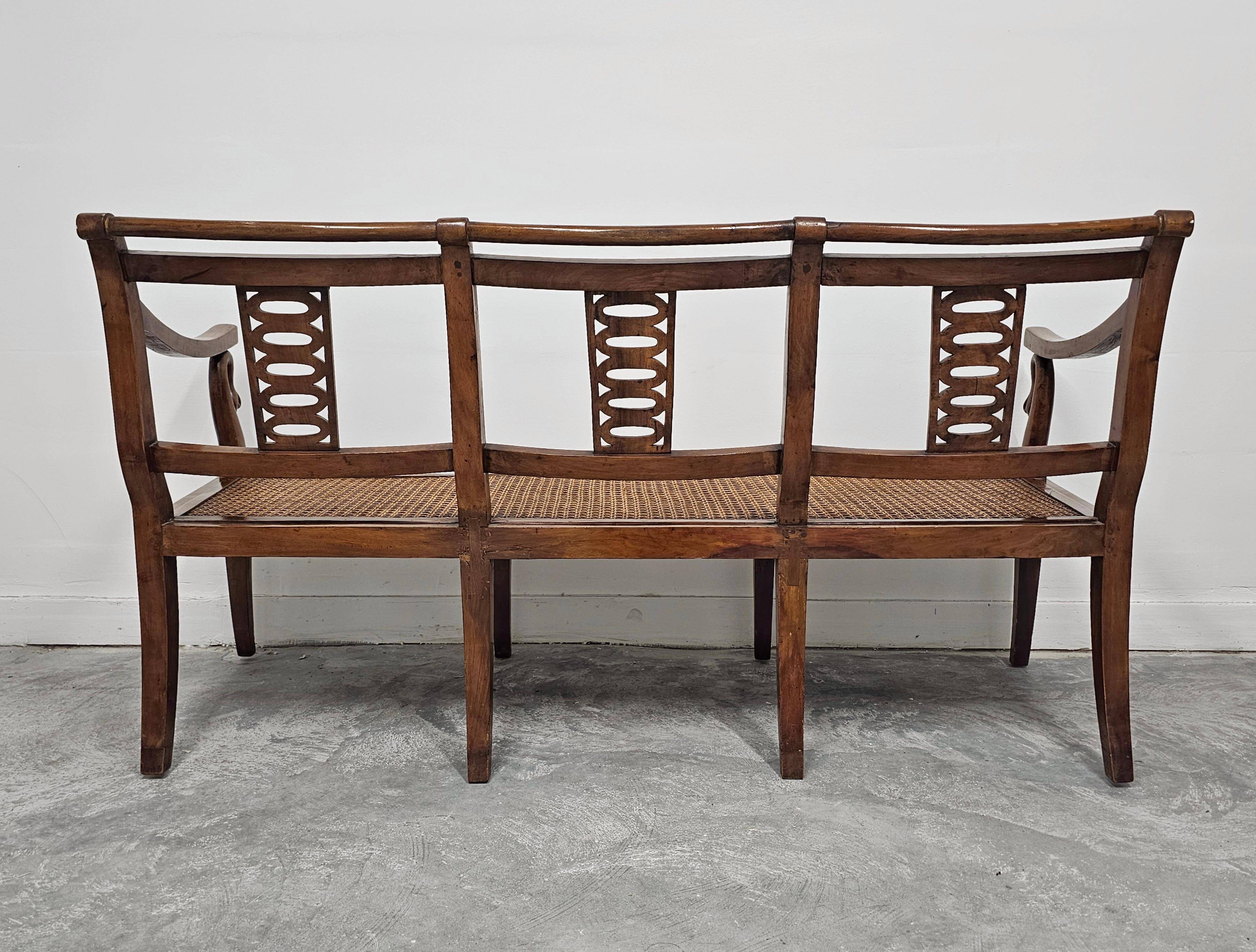 Directoire canapé in walnut with brass inlays, late 18th century.