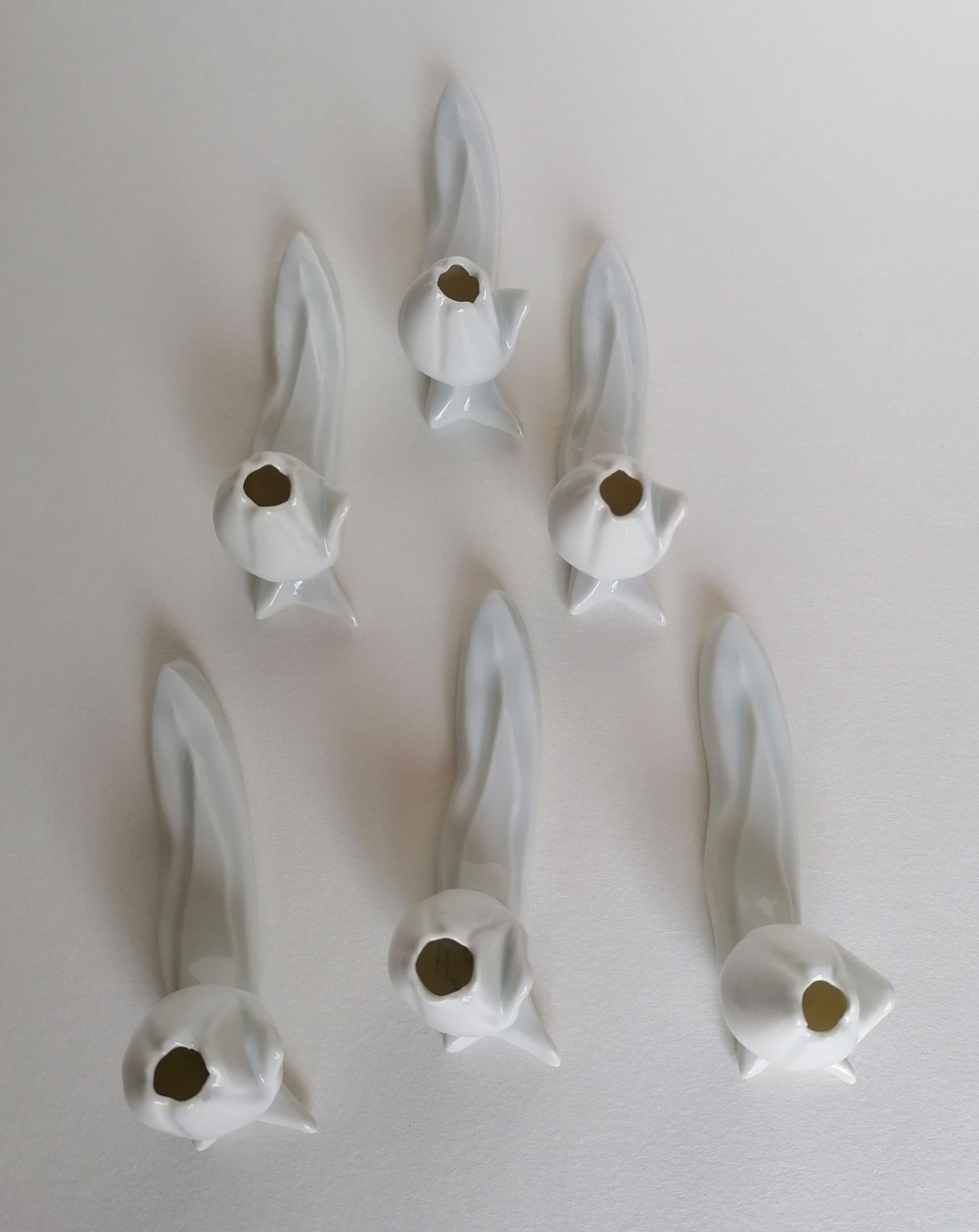 6 white porcelain knife holders