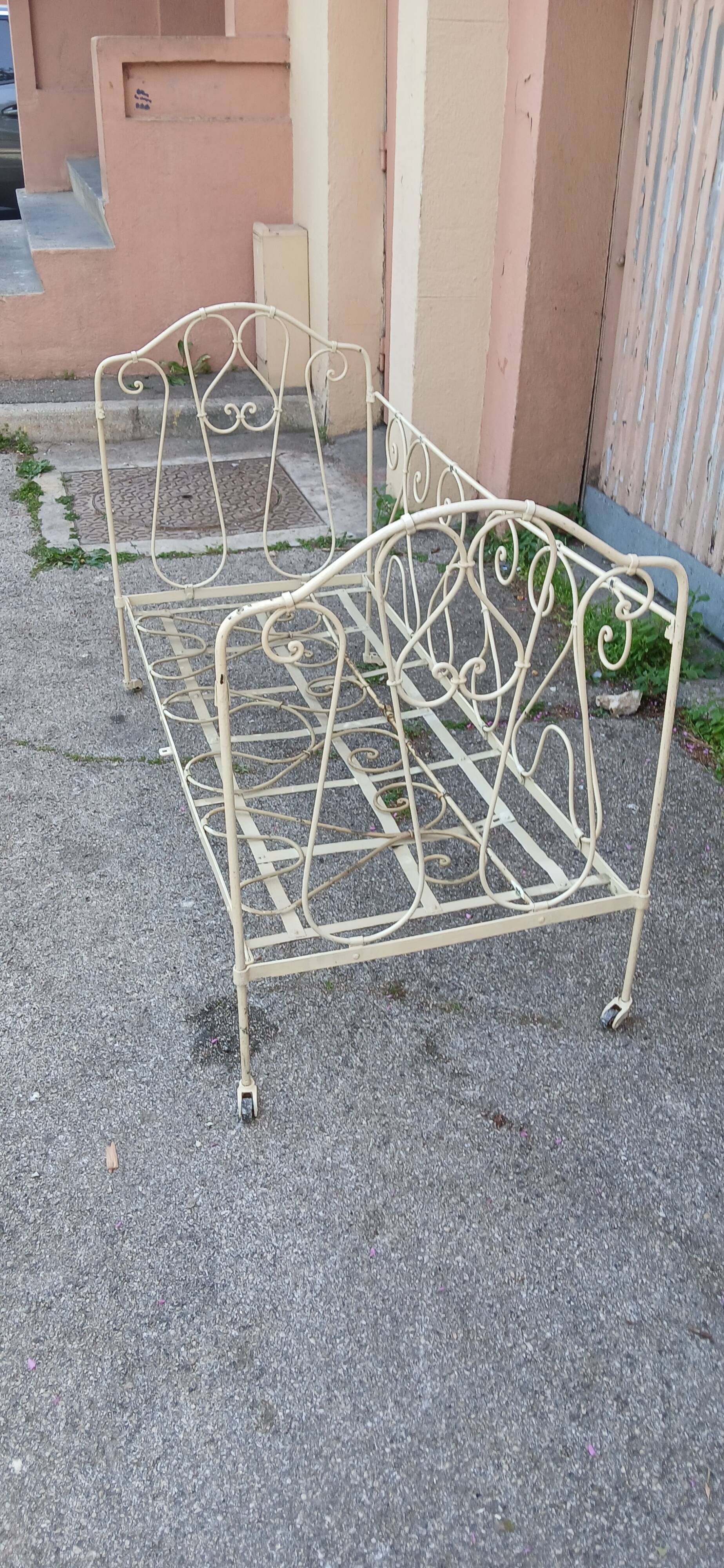 Magnificent bench/antique wrought iron bed.