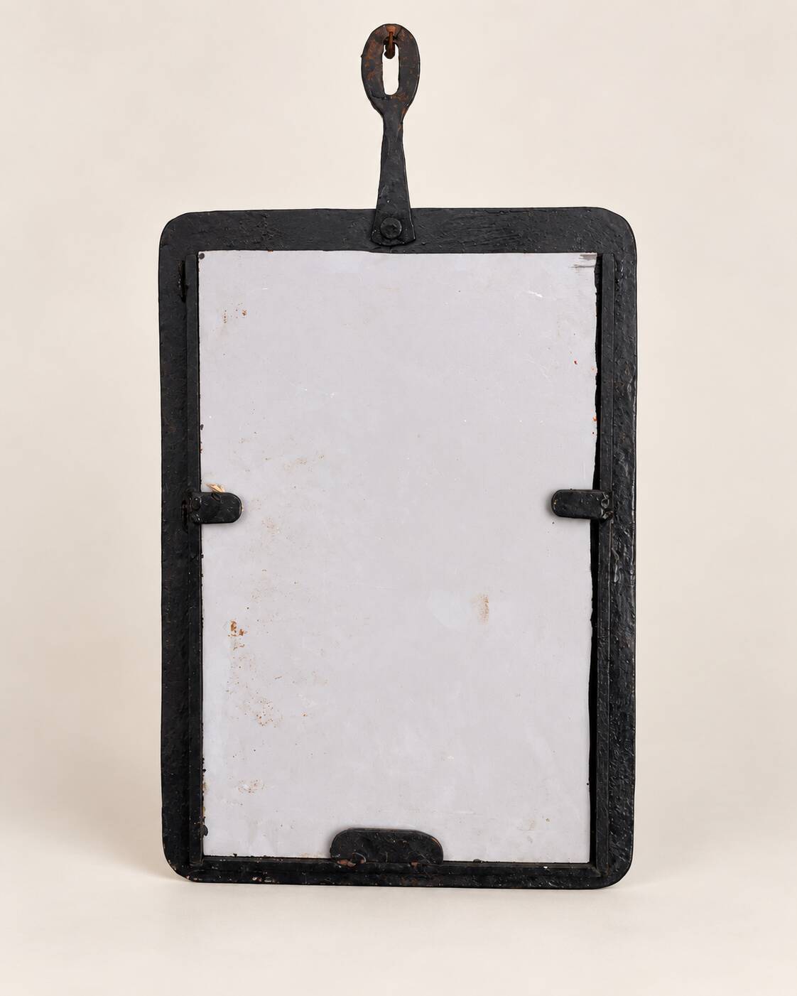 Vintage black wall mirror with floral decoration